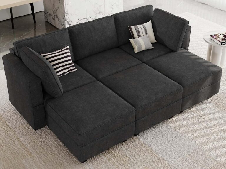 A modern modular sectional sofa in a spacious living room, featuring a sleek design and plush cushions for maximum comfort.