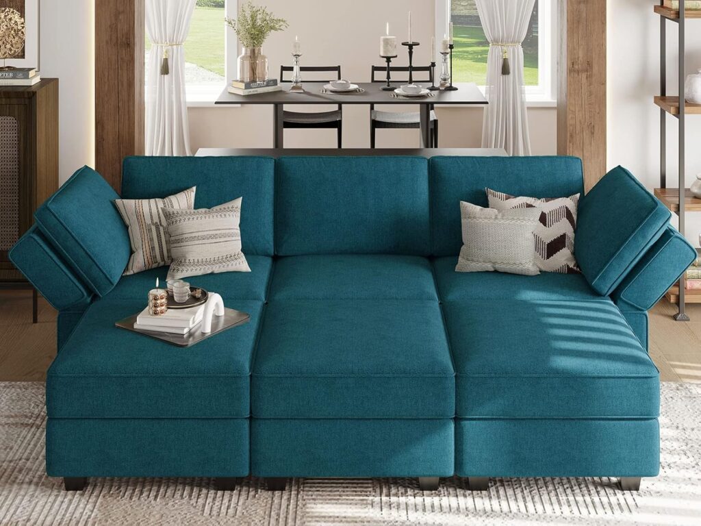 A modern modular sectional sofa in a spacious living room, featuring a sleek design and plush cushions for maximum comfort.